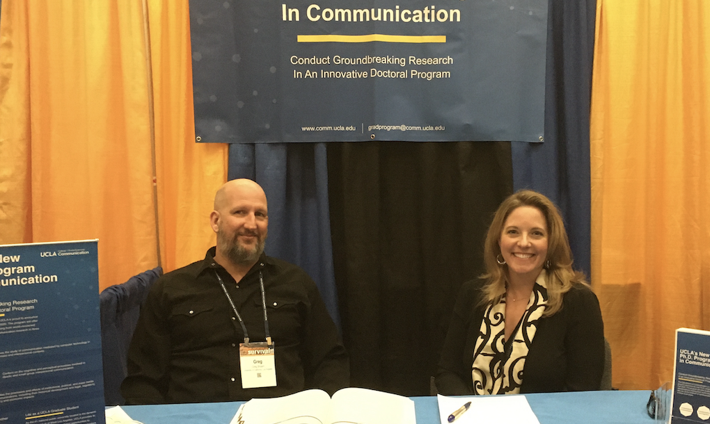 Communication department faculty tabling at an event